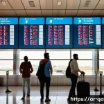 카타르 직항 항공권 가격 - A vibrant airport scene in Doha, Qatar during the national holiday with Arabic signage and decoratio...